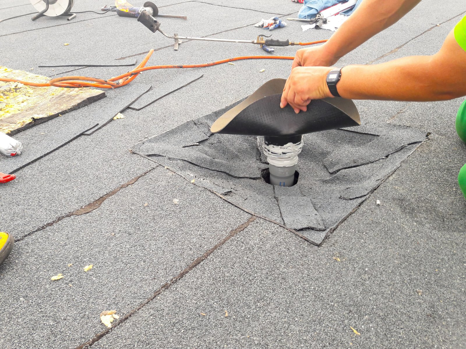 durham-roof-leak-repair A professional roofing contractor in Durham, is installing a durable roofing membrane for maximum durability and leak prevention