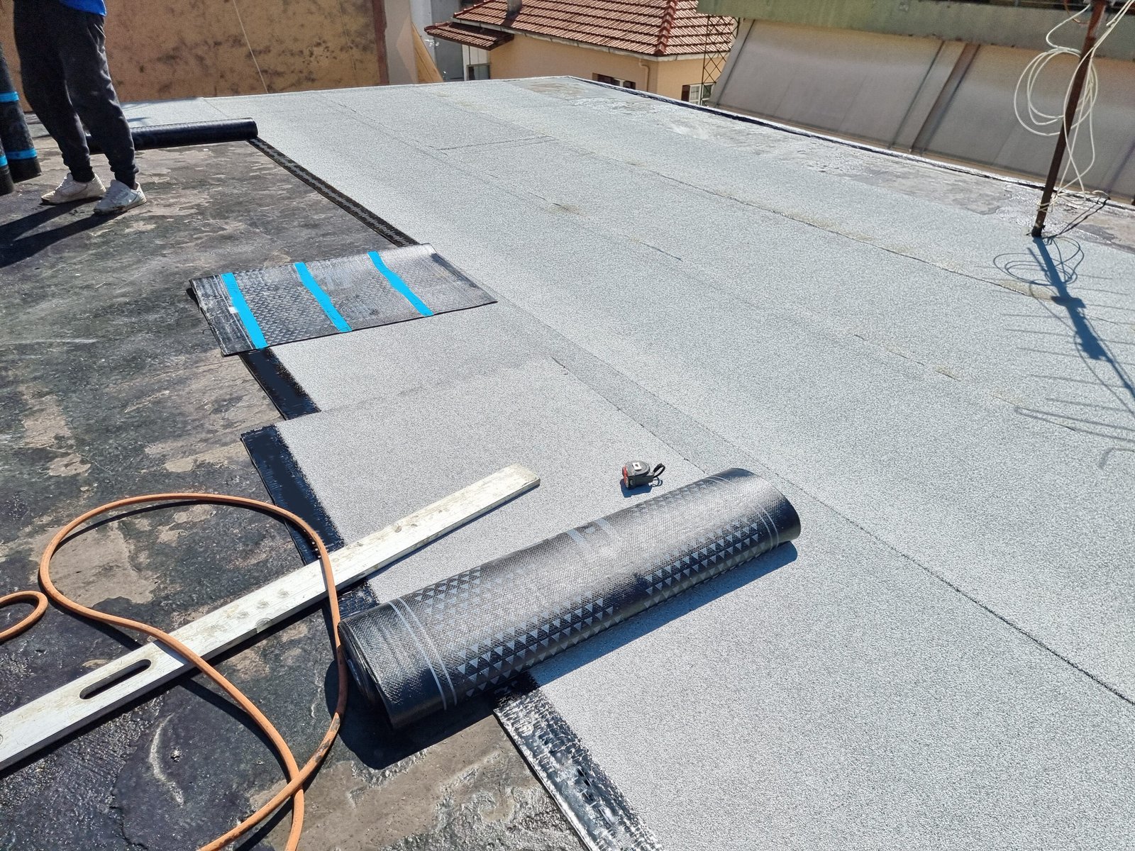 durham-roof-leak-repair tarmac contact installing tarmac terrace on the roof of a building in Durham, On
